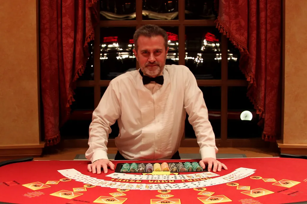 Casino dealer in formal attire behind a blackjack table
