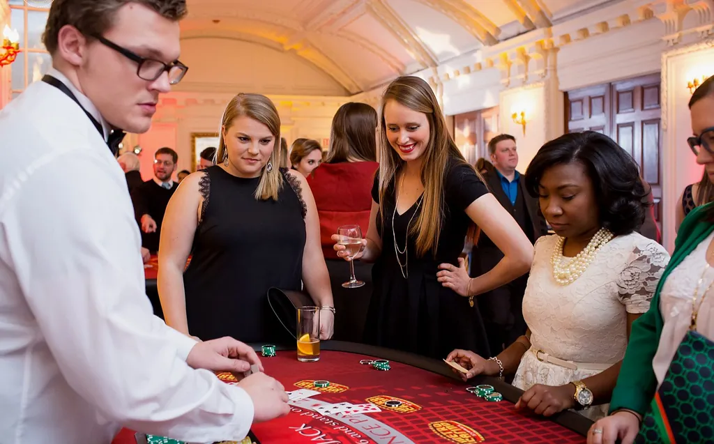 Guests playing blackjack with a dealer
