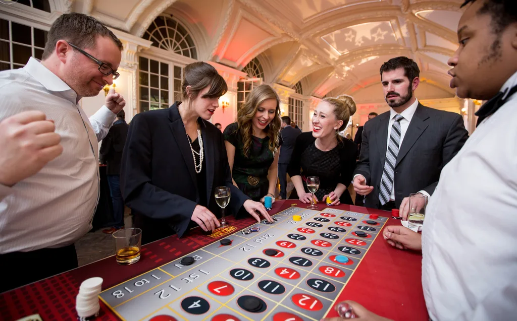Guests playing roulette at a formal event