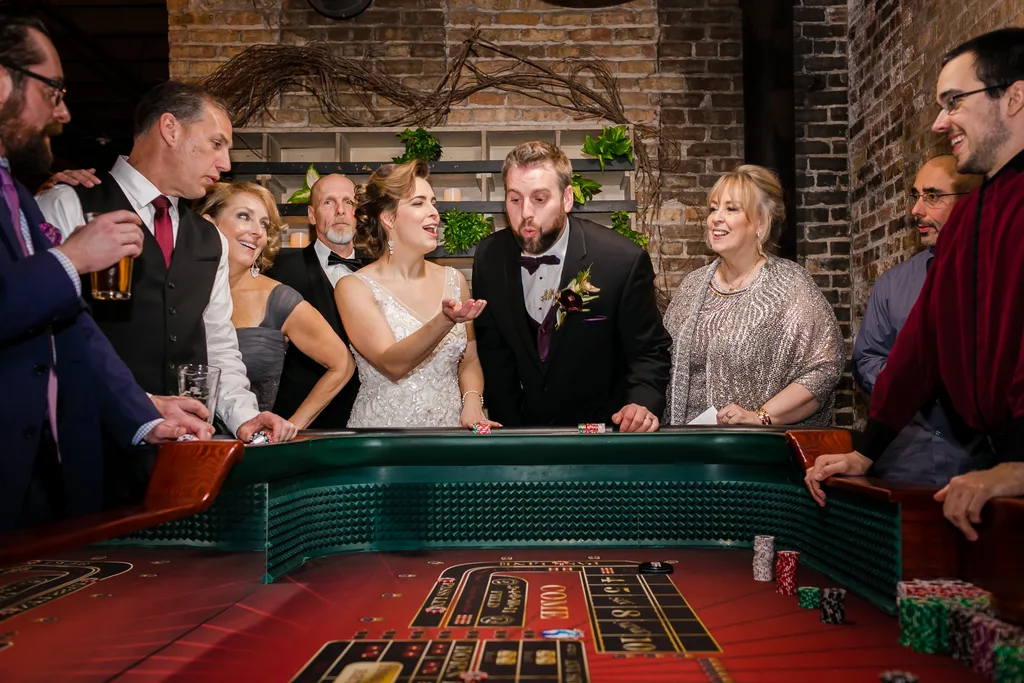 Guests reacting around a blackjack table at a casino night