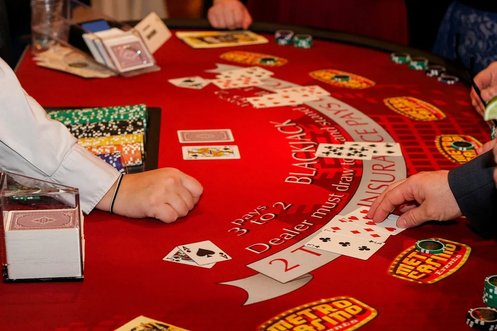 Close-up of cards and chips on a blackjack table
